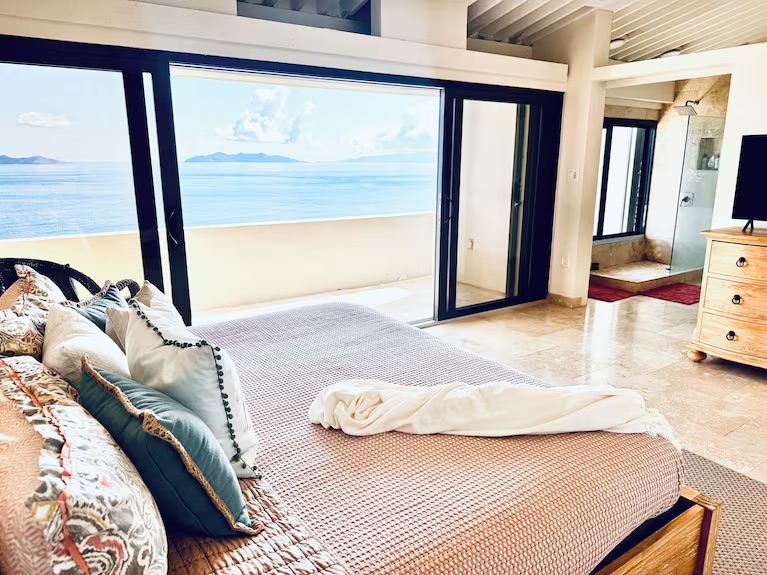 Large primary bedroom with ensuite bathroom.  Look at those views from the bed!