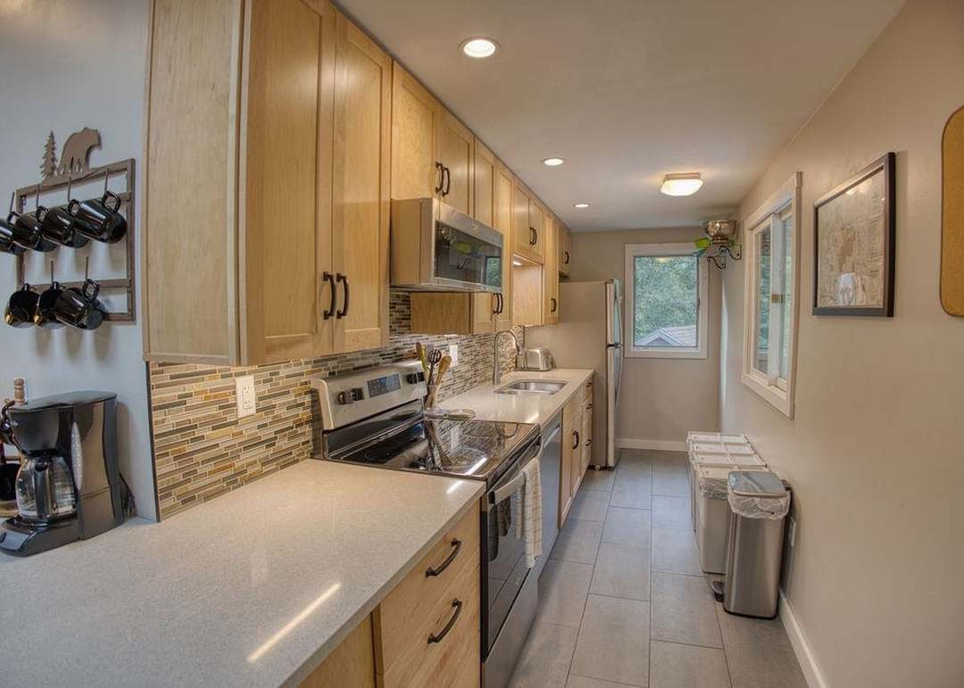 Galley Kitchen stocked with all you need to make yourself at home