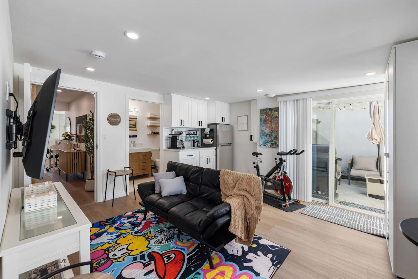Game Room w/ Arcade Couch bed, kitchenette, exercise bike, slider to outdoor patio.