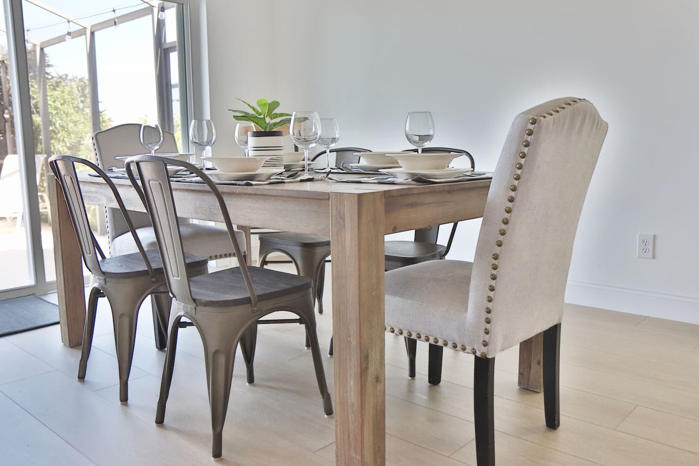 Dinning table that seats 6 with views to the patio, pool, and lake