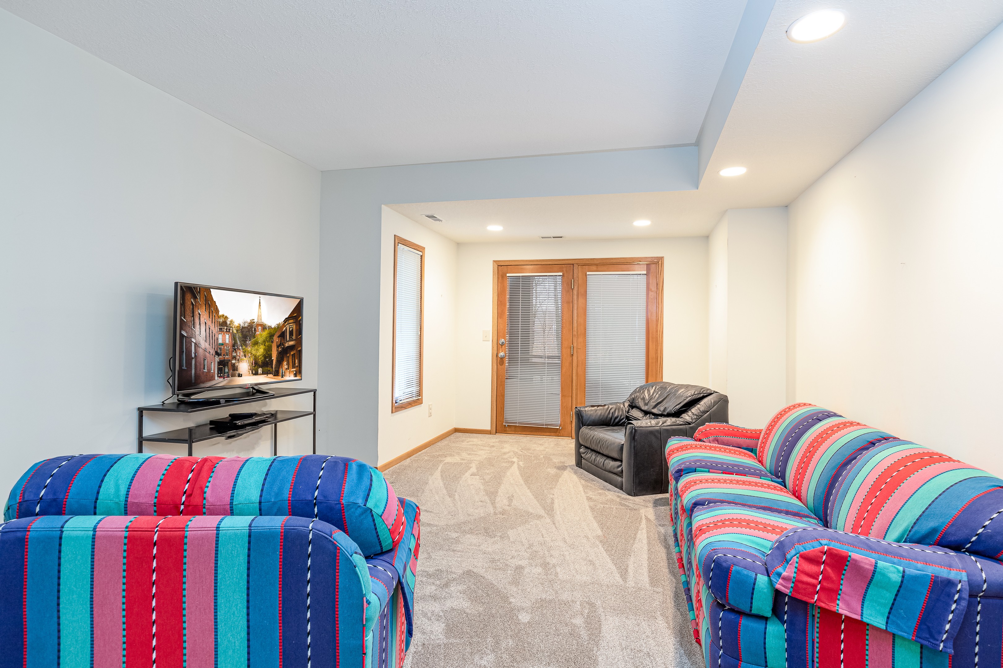 Lower level living room with smart TV and sleeper sofa