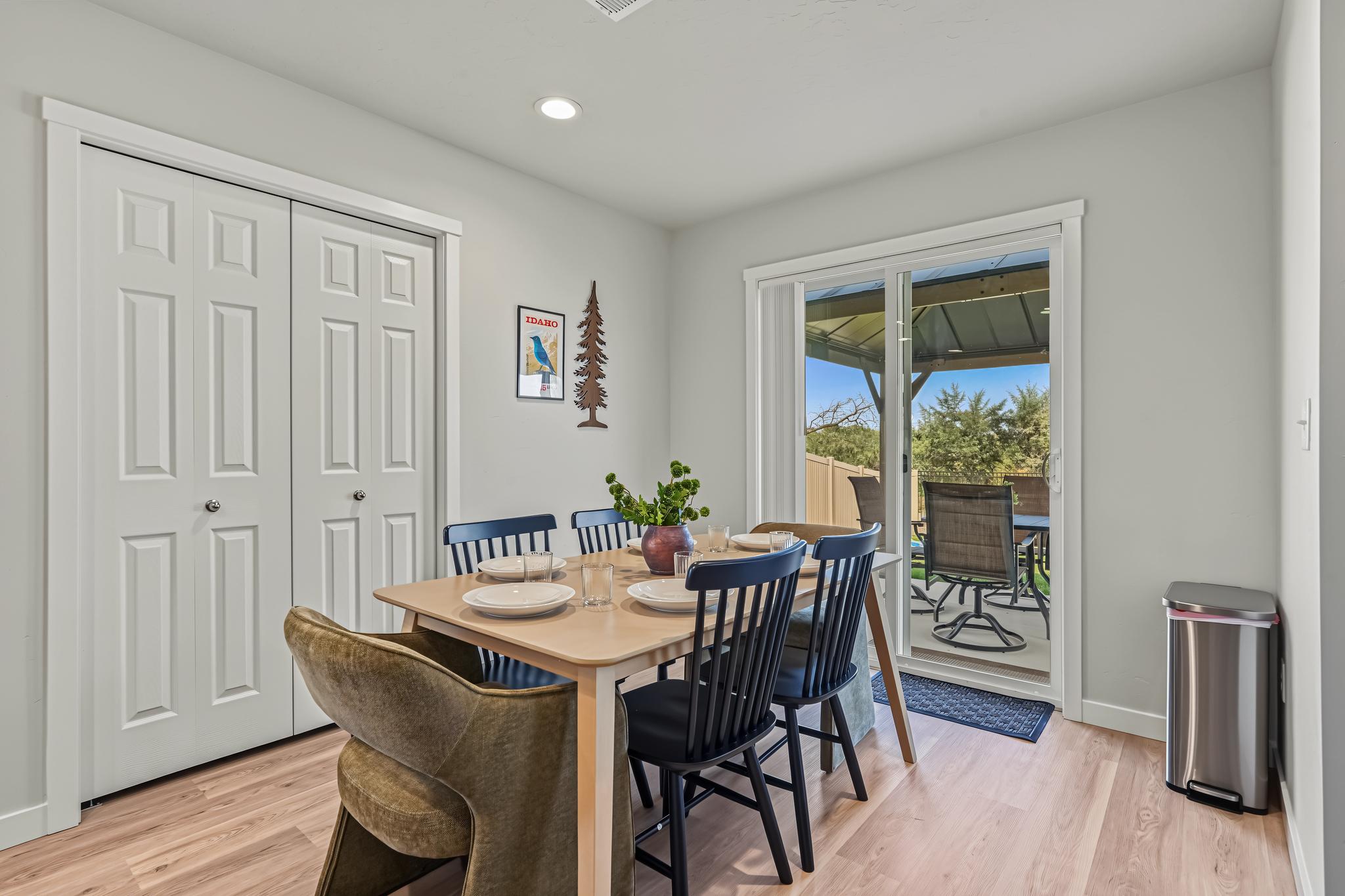 Dinner area that leads outside to the fenced backyard.