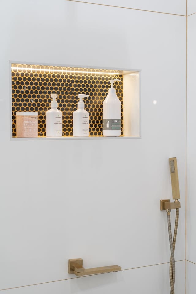 Our modern bathroom features top-notch shampoo and conditioner for your hair care needs! Feel refreshed and ready for the day ahead.