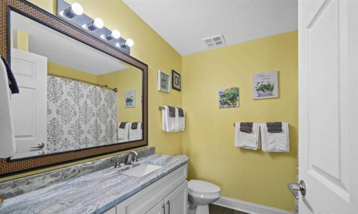 Ensuite bathroom with vanity and tub/shower combo