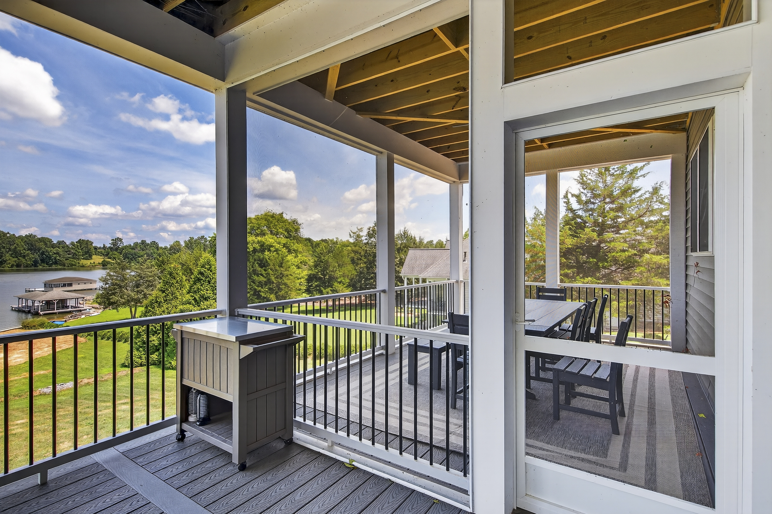 The screened-in porch is perfect for outdoor meals, bug-free sunsets, and lakeside conversations.