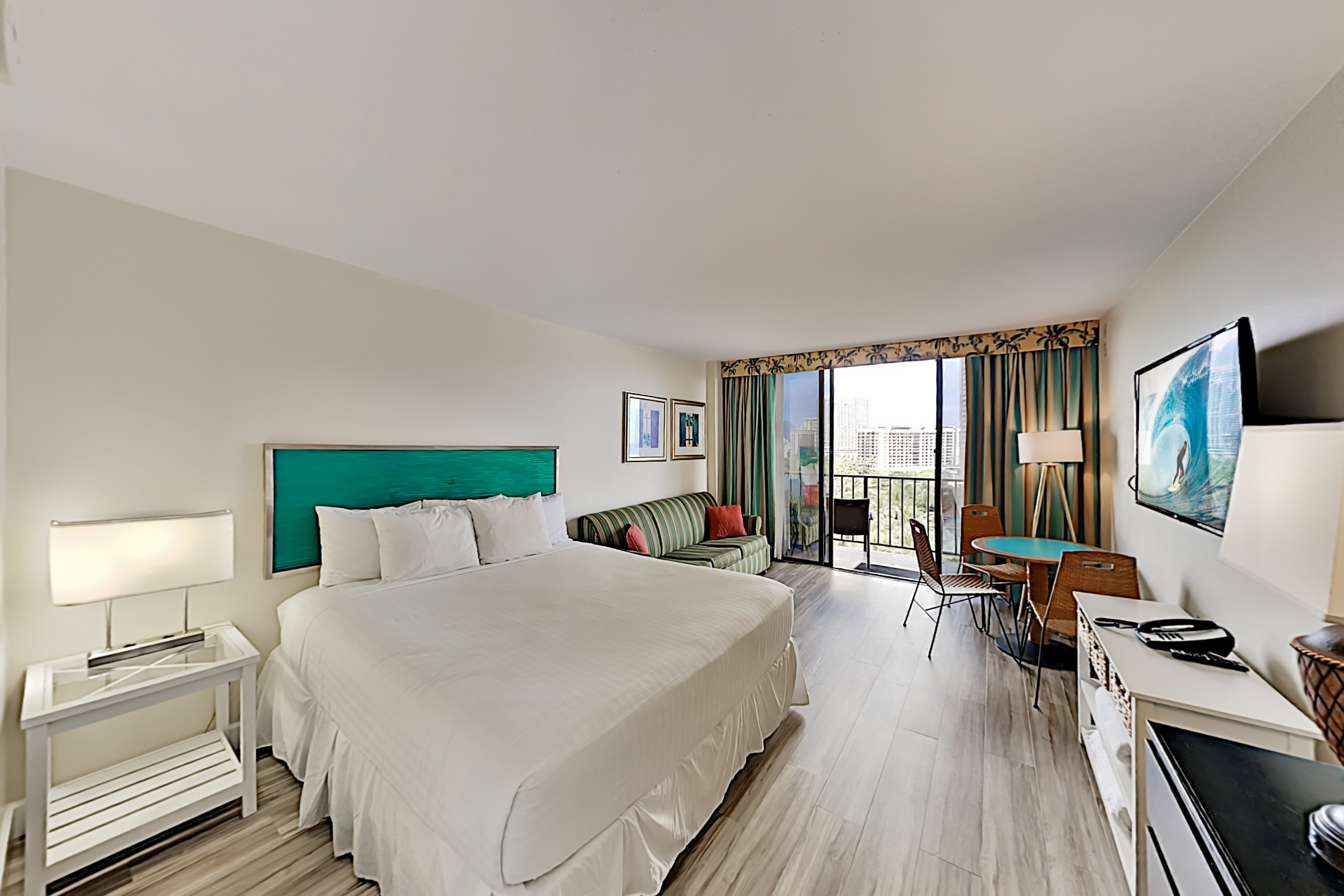 Updated flooring in studio with king bed, queen sofa sleeper, dinette and  
private lanai