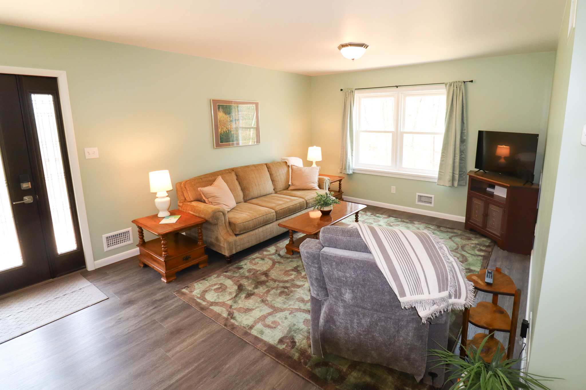 Cozy living room with woodland views