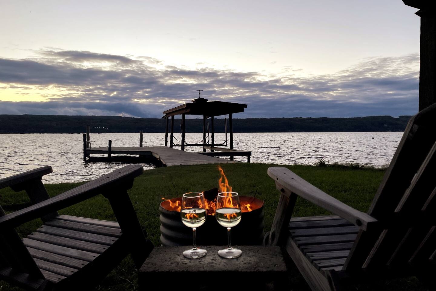 Waterfront | Nearly 100ft of flat, grass, beachfront for games or lounging by the fire fit.