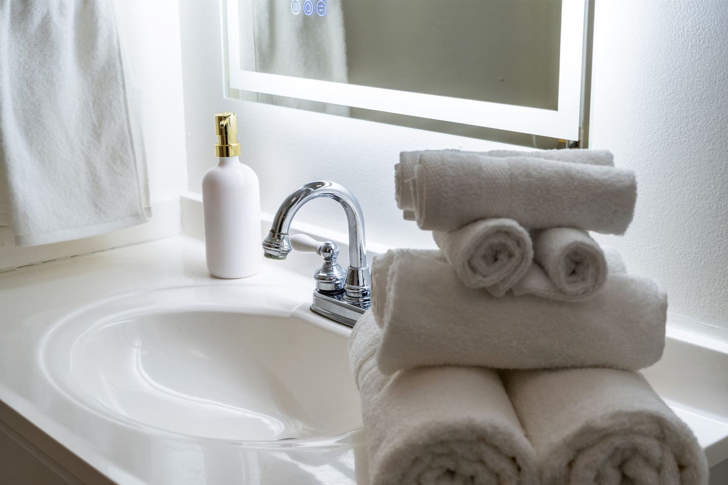 Crisp white towels, sleek finishes, and calming decor—our spa-inspired bathrooms are stocked and ready for your stay.