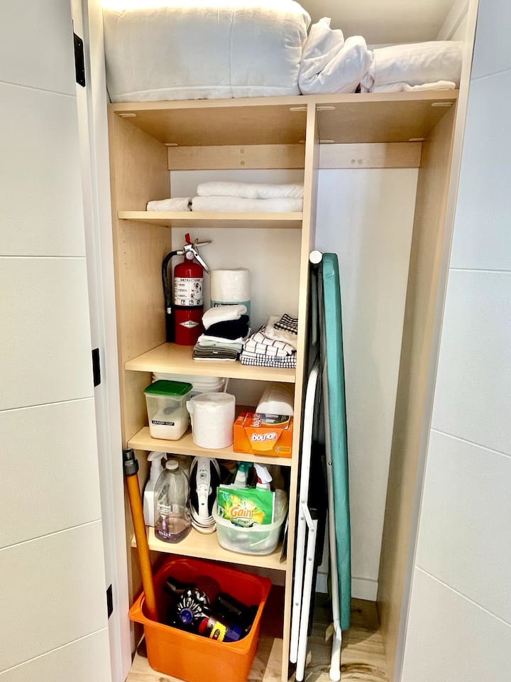 Supply closet 2nd floor hallway: Ironing board, towels & linens, cleaning & laundry supplies, fire extinguisher, vacuum, step ladder, paper towel, toilet paper etc.