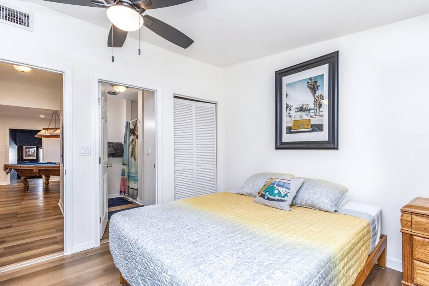 Guest Room suite with 1-queen bed. Beach Wagon themed room and private bathroom. 