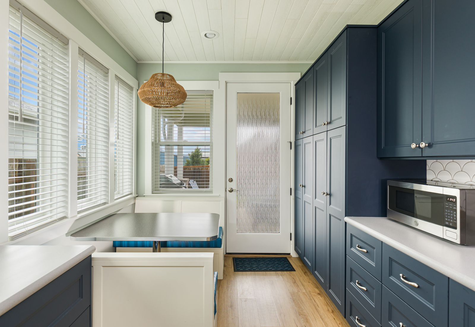 Eat-in booth with ample cabinets with storage