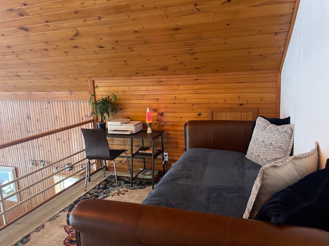 Loft seating area overlooking the main living space.