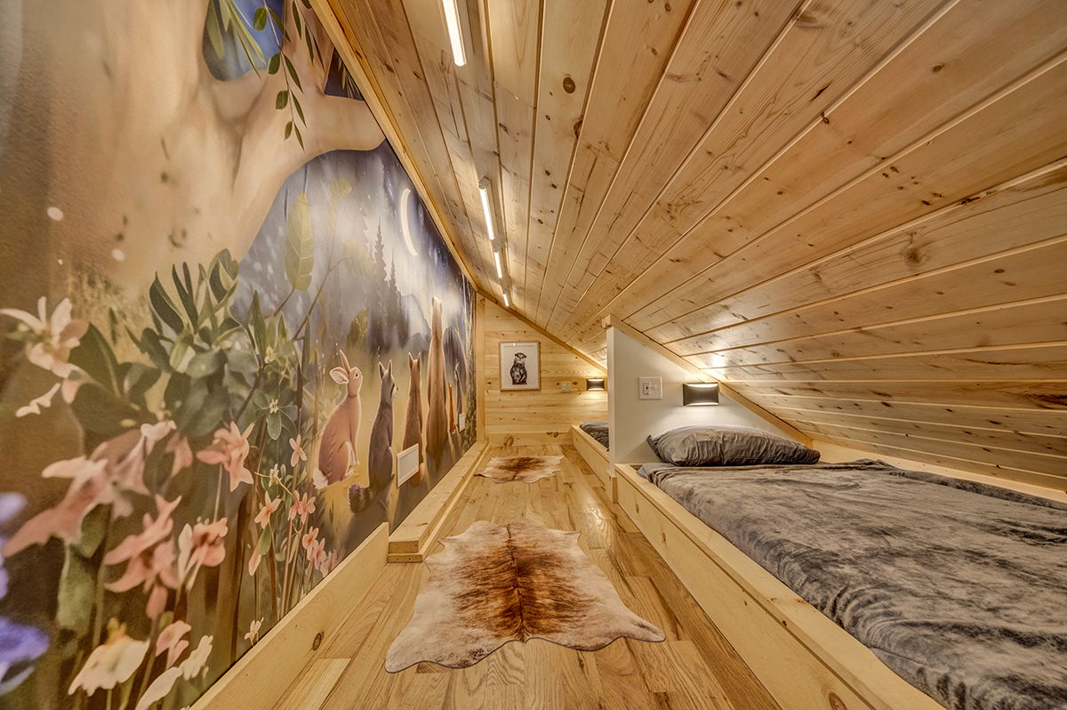 Custom built-in twin beds with individual reading lights, white noise machine and cozy bedding.