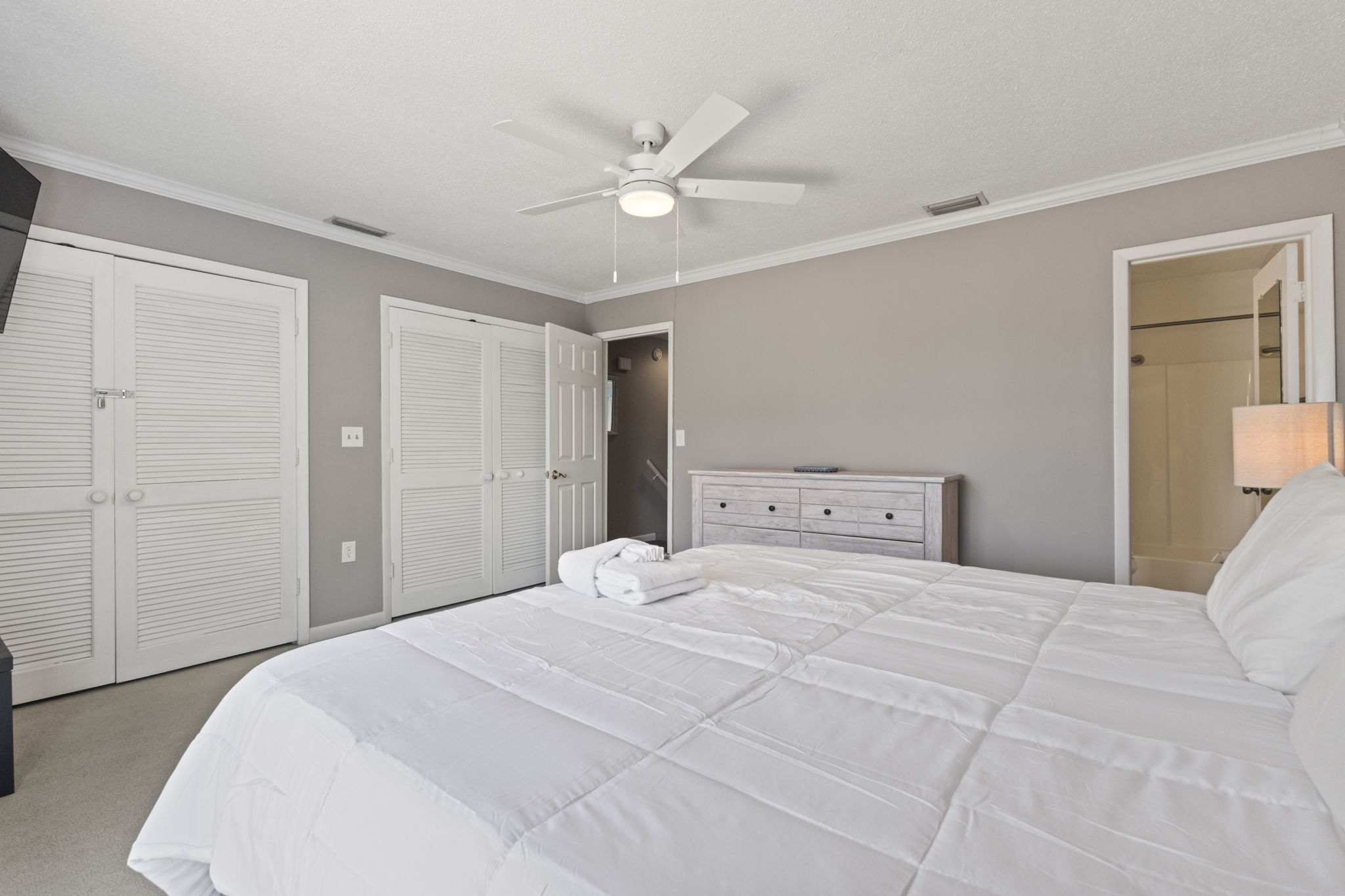 Primary Bedroom with King Bed, Smart TV & Ensuite Bathroom and Balcony