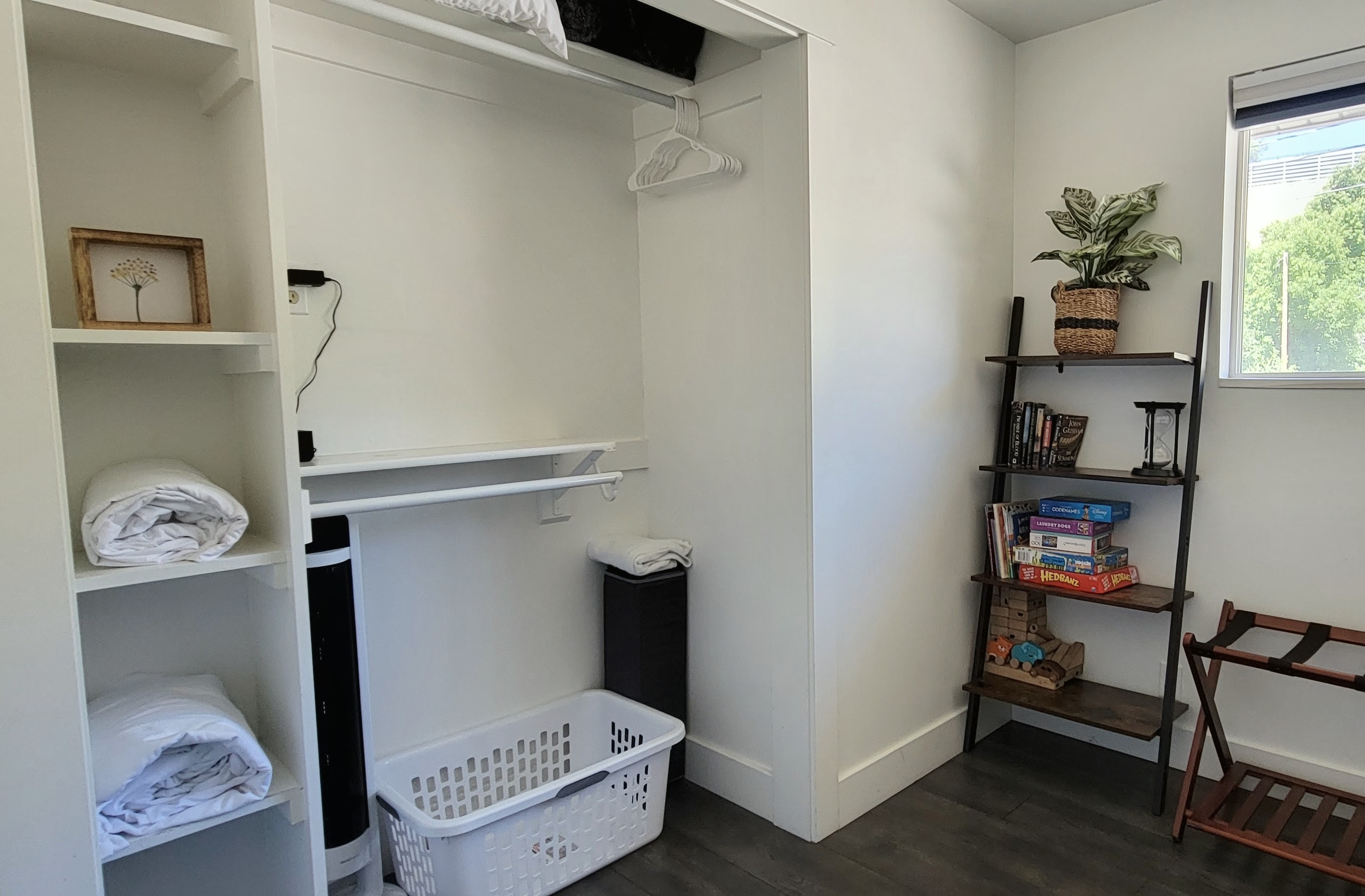 Closet in third bedroom. Pack n' play, extra blankets, pillows, and sheets. Bookshelf with toys, books, and games.