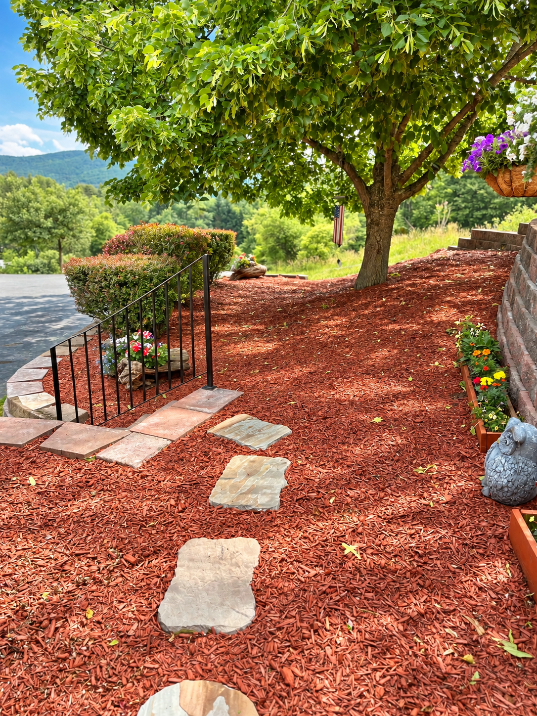 Terraced walkway from driveway to backyard with grill and pool