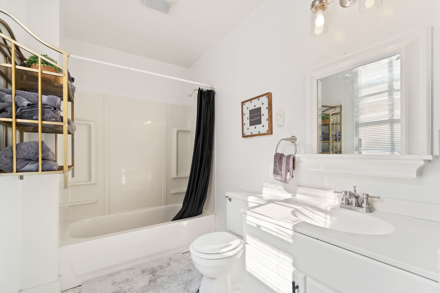 Spacious full bathroom featuring a relaxing bathtub, perfect for unwinding after a long day, along with sleek fixtures and modern finishes for a comfortable experience.