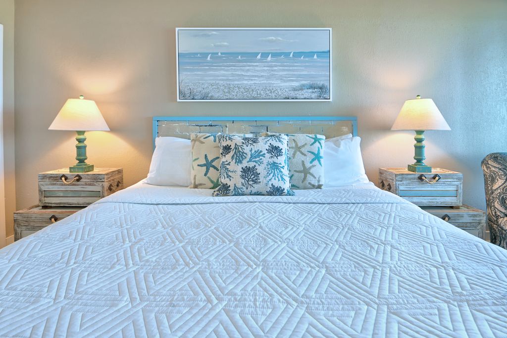 Rest up after a day in the sun in this plush, coastal-themed master suite.