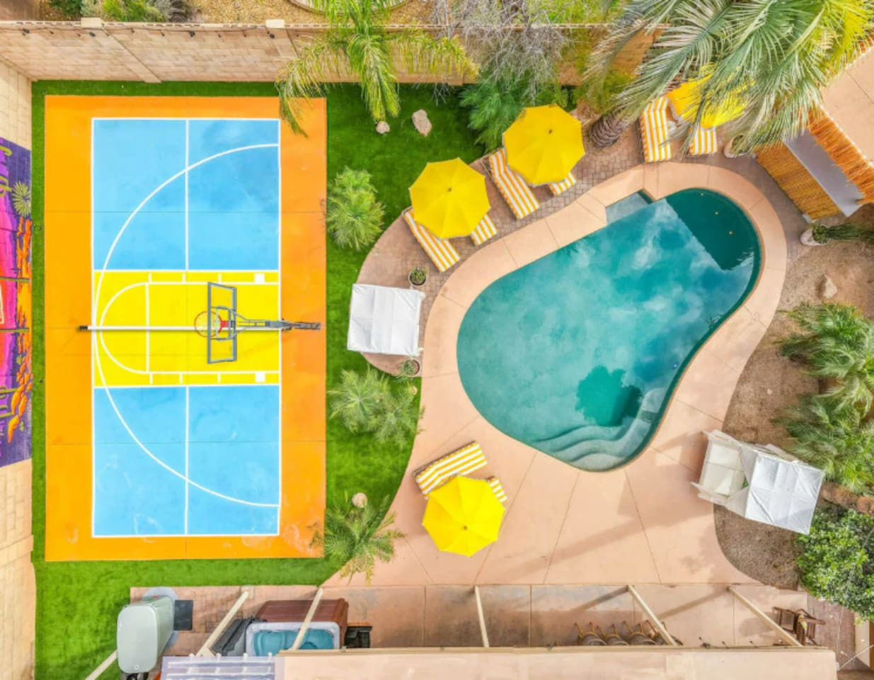 Straight-down drone view captures the pool and sport court.