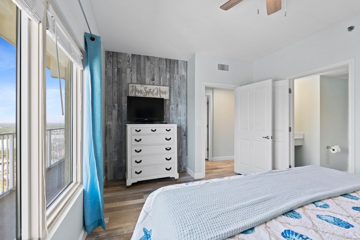 Main bedroom 2 with ceiling fan and ensuite access