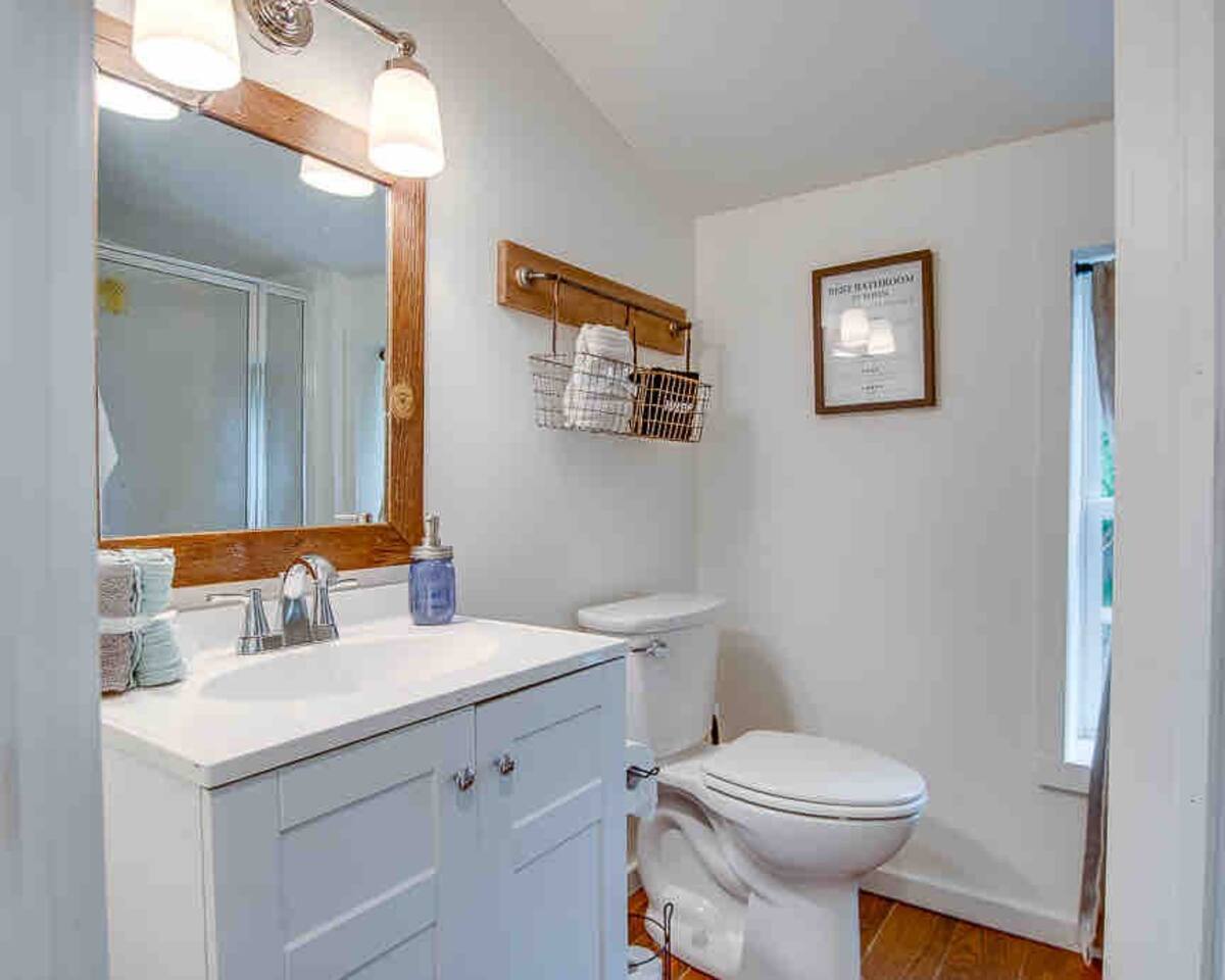 Bathroom off the master bedroom. Downstairs full bathroom with wall in shower.