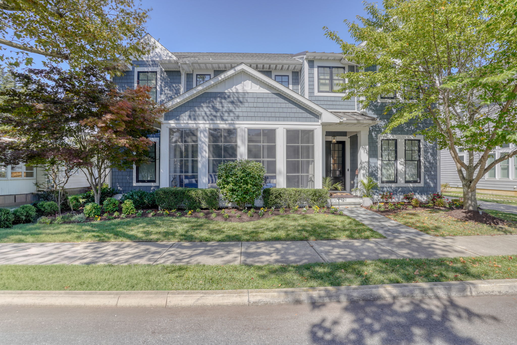 Beautifully landscaped front yard and screened porch