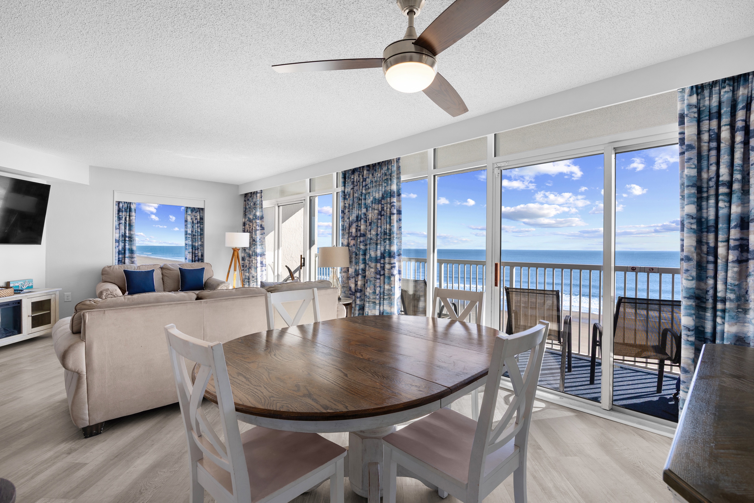 Dining area and Living Room with Sliders to large balcony