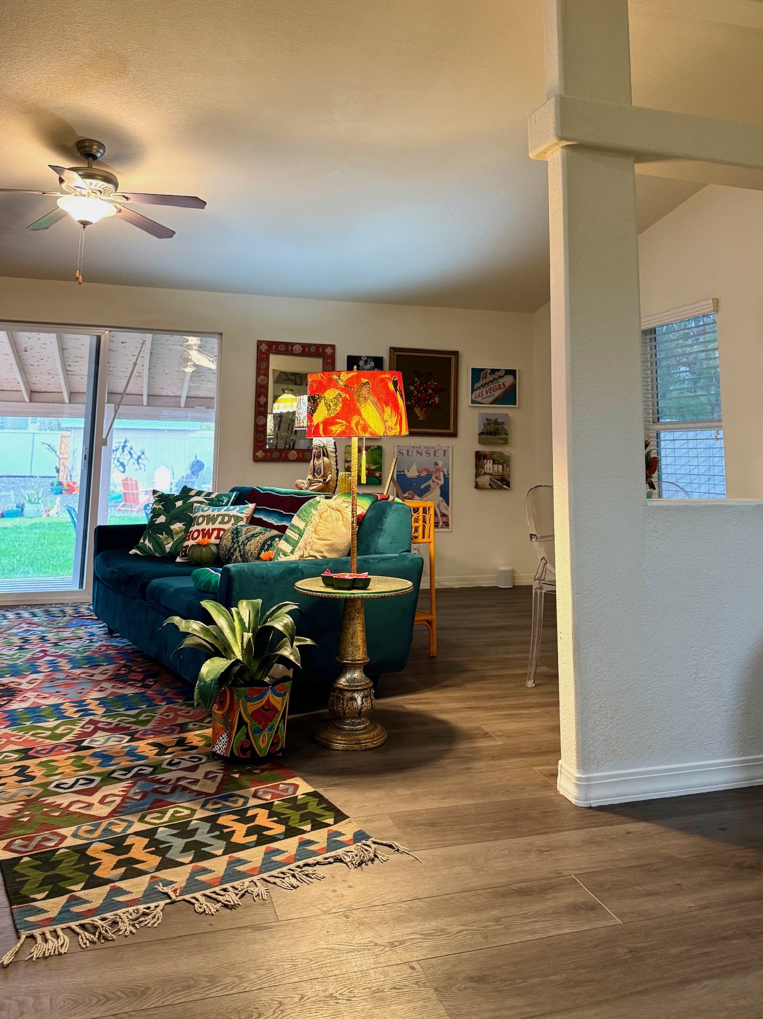 2nd living room with large smart tv & sofa that has a queen pull out bed.