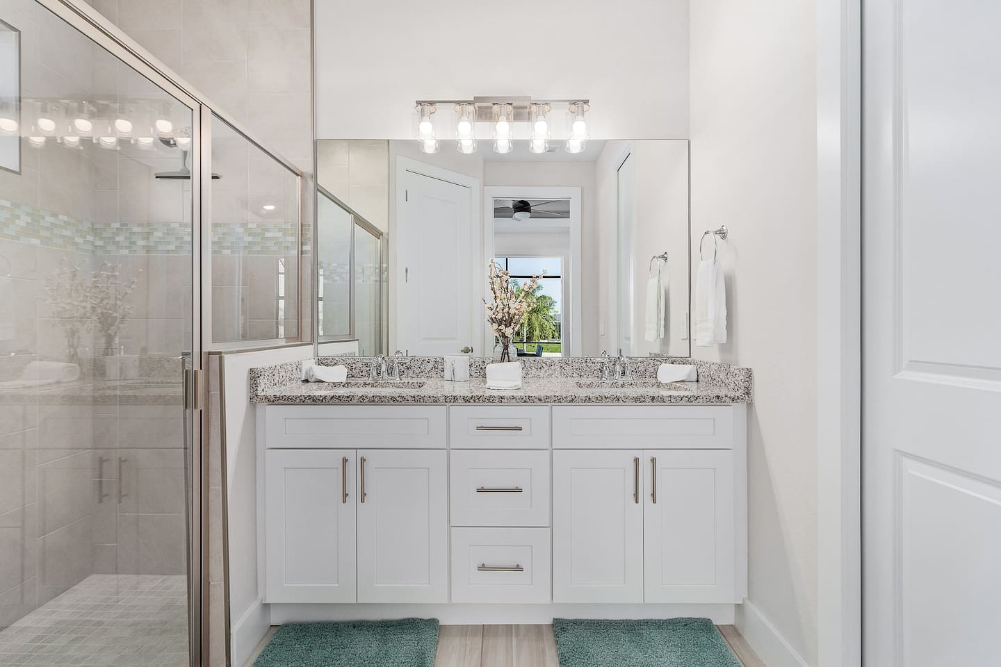 2nd Primary ensuite bathroom with dual sinks and shower.