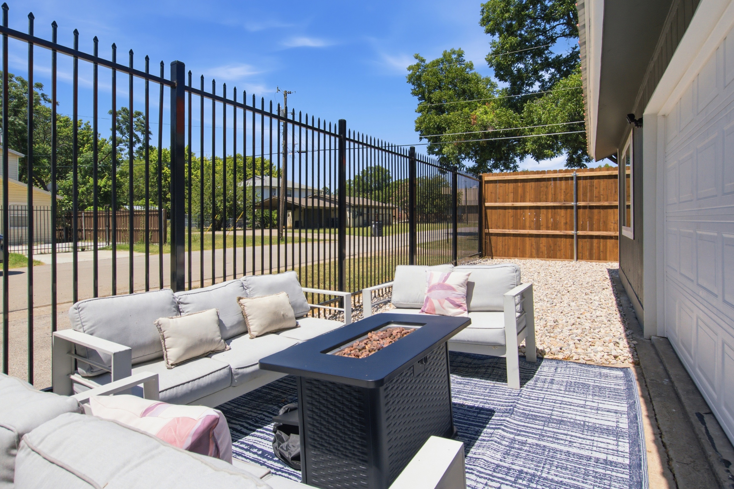 Relax under the Texas sun with plush seating and a fire pit for evening vibes!