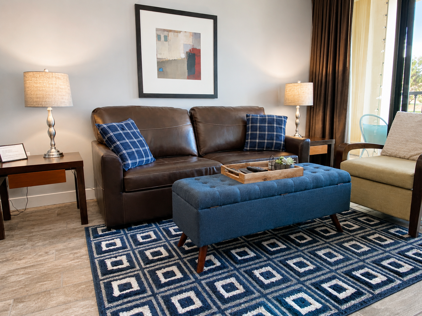 Comfortable living room with smart TV, queen sleeper sofa and balcony access.