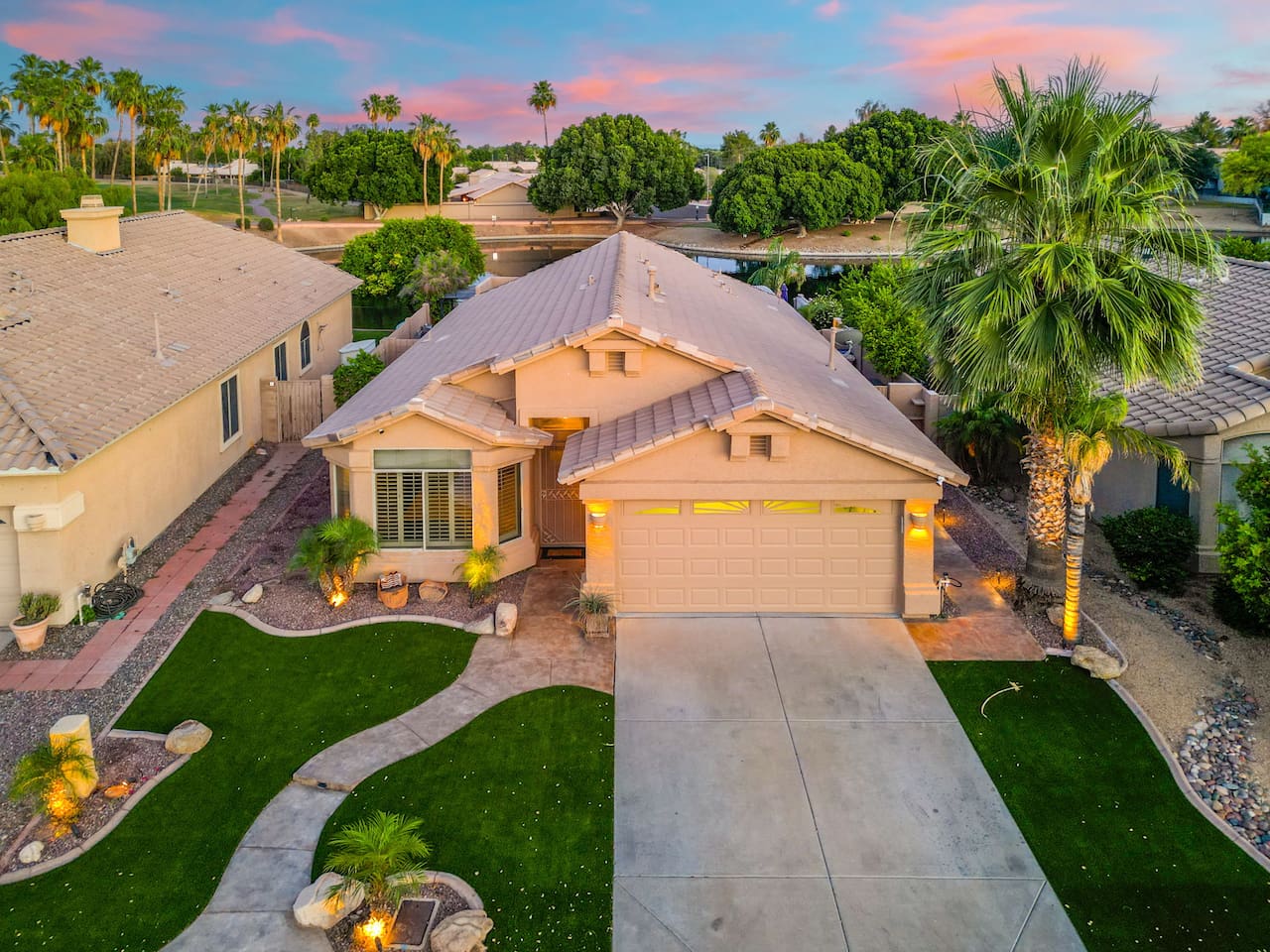 Tucked into a quiet neighborhood with palms swaying and the sky ablaze at dusk, this home immediately feels like the escape you've been looking for.