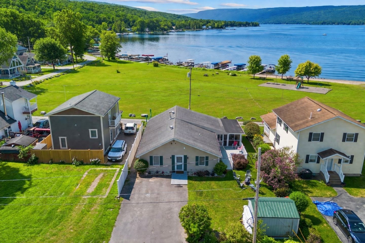 Charming lakeside retreat with ample green space and easy access to Honeoye Lake. Ideal for family gatherings and outdoor fun. 