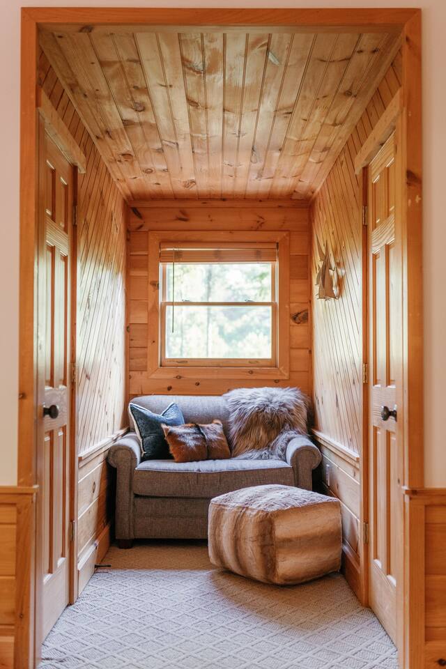 Cozy reading nook in bedroom. 