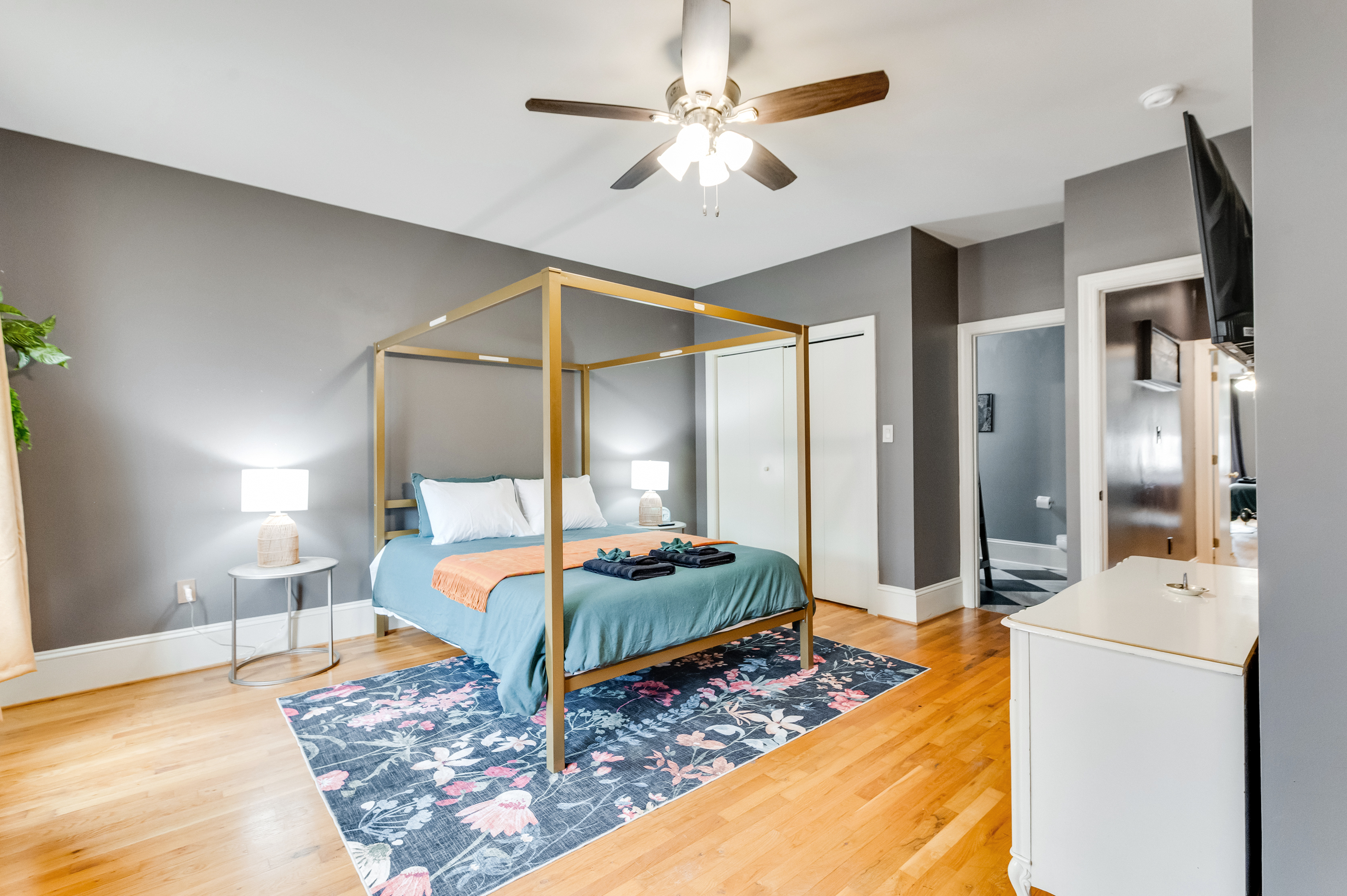 Queen Bedroom 2: Elegant design meets comfort with a chic canopy bed and vibrant decor!