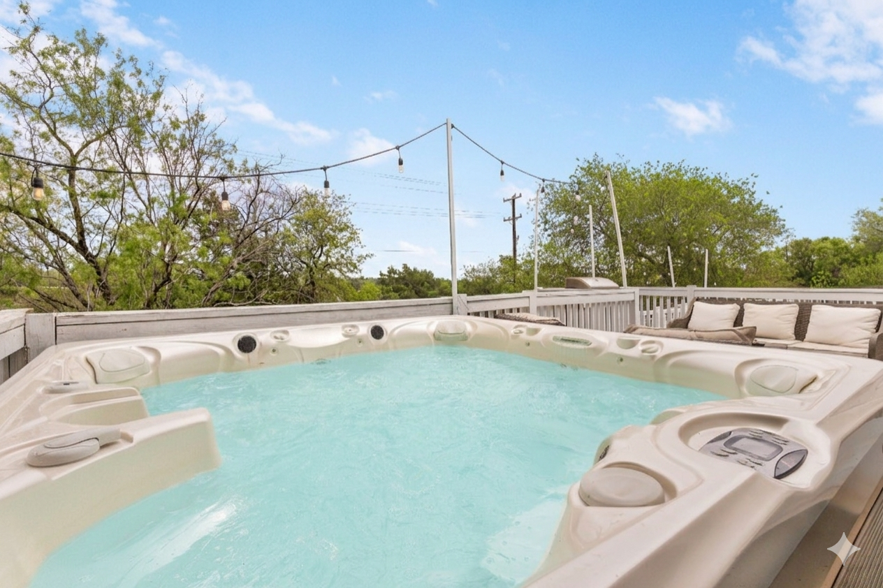 Enjoy a relaxing soak in the hot tub for ultimate comfort.
