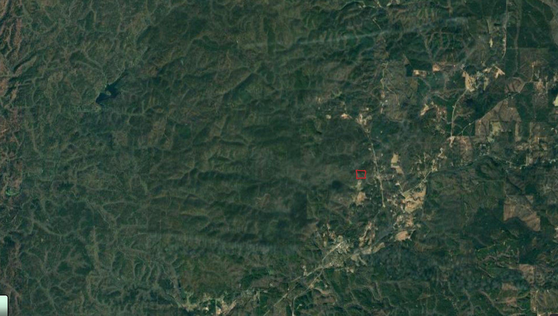 This gives some idea of the surrounding land.  The property is located in the red square.