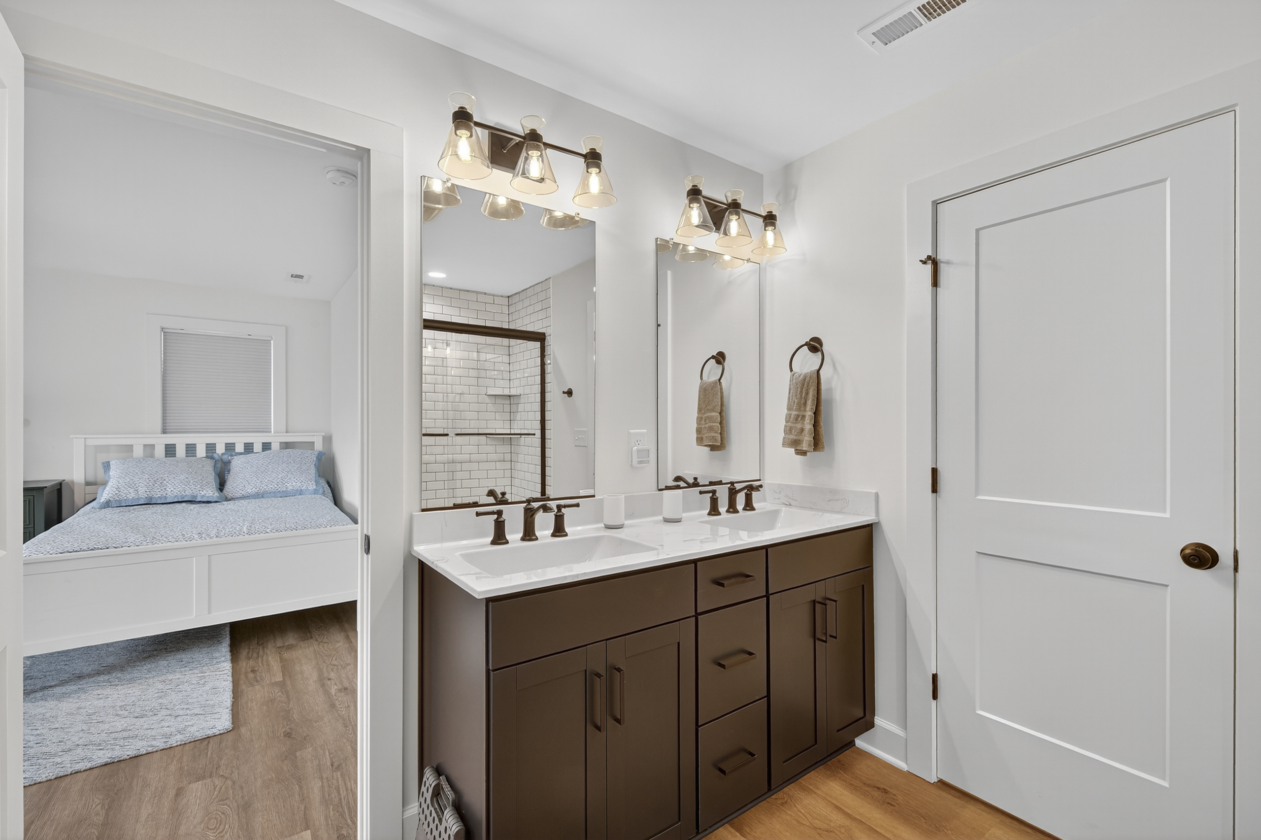 Dual-sink vanity offers ample space for morning routines or evening wind-downs.