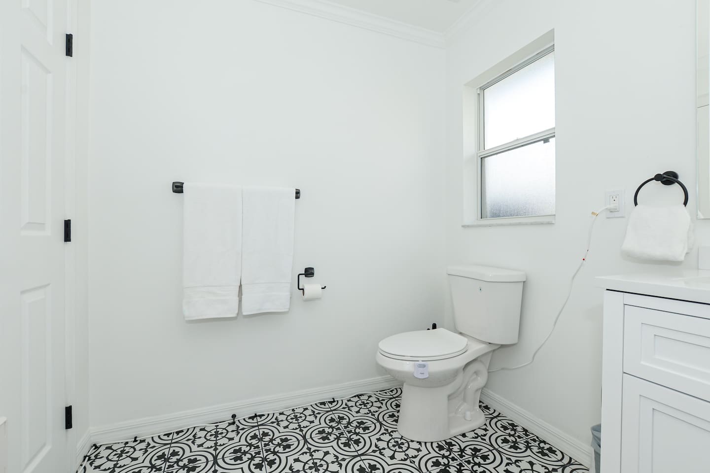 Bathroom with a separate toilet area for added privacy and convenience.
