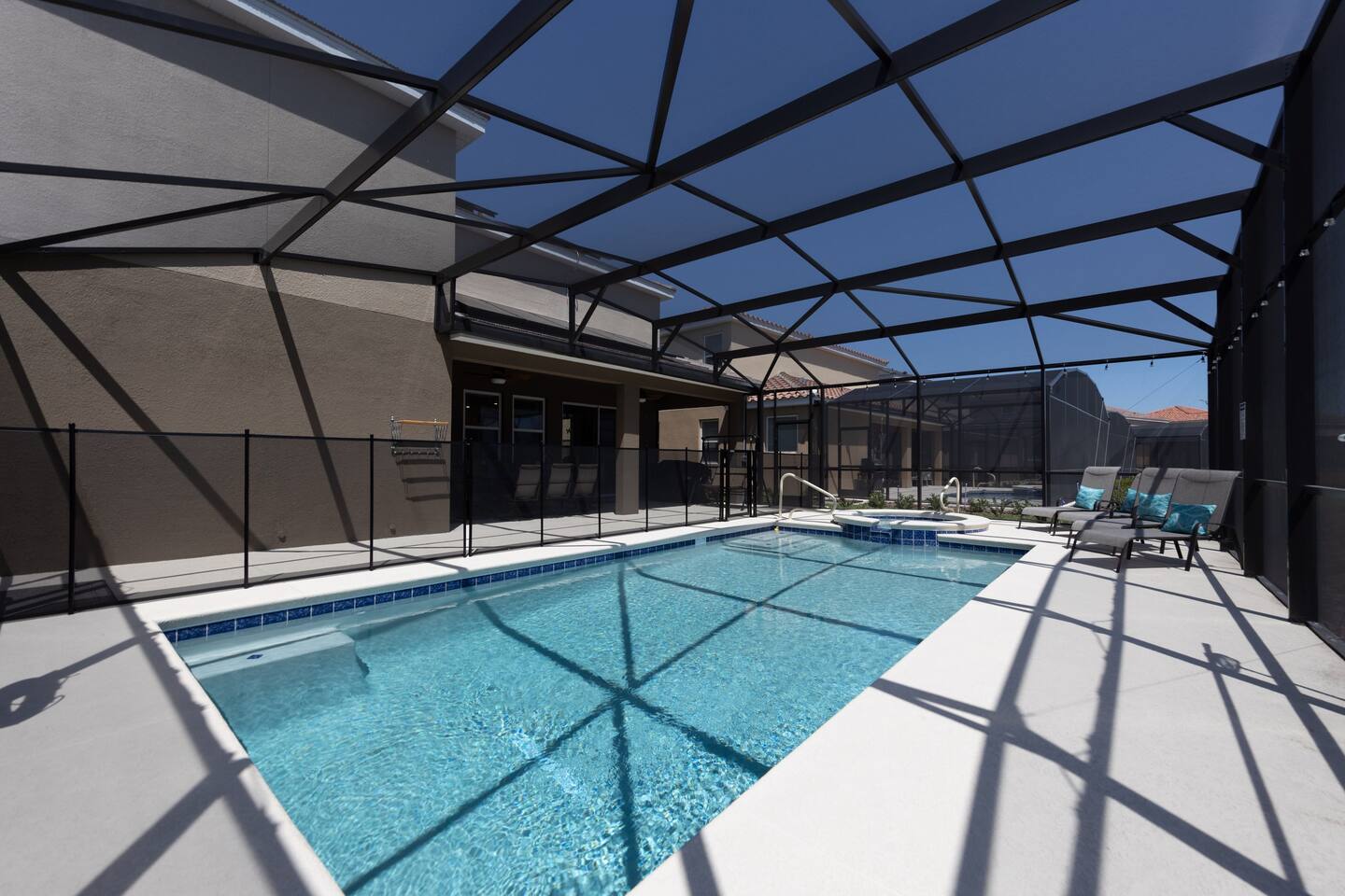 Oversized heated pool, complete with hot tub with four chaise lounge chairs. Pool comes with colored LED lights to ensure any night swims magical. 