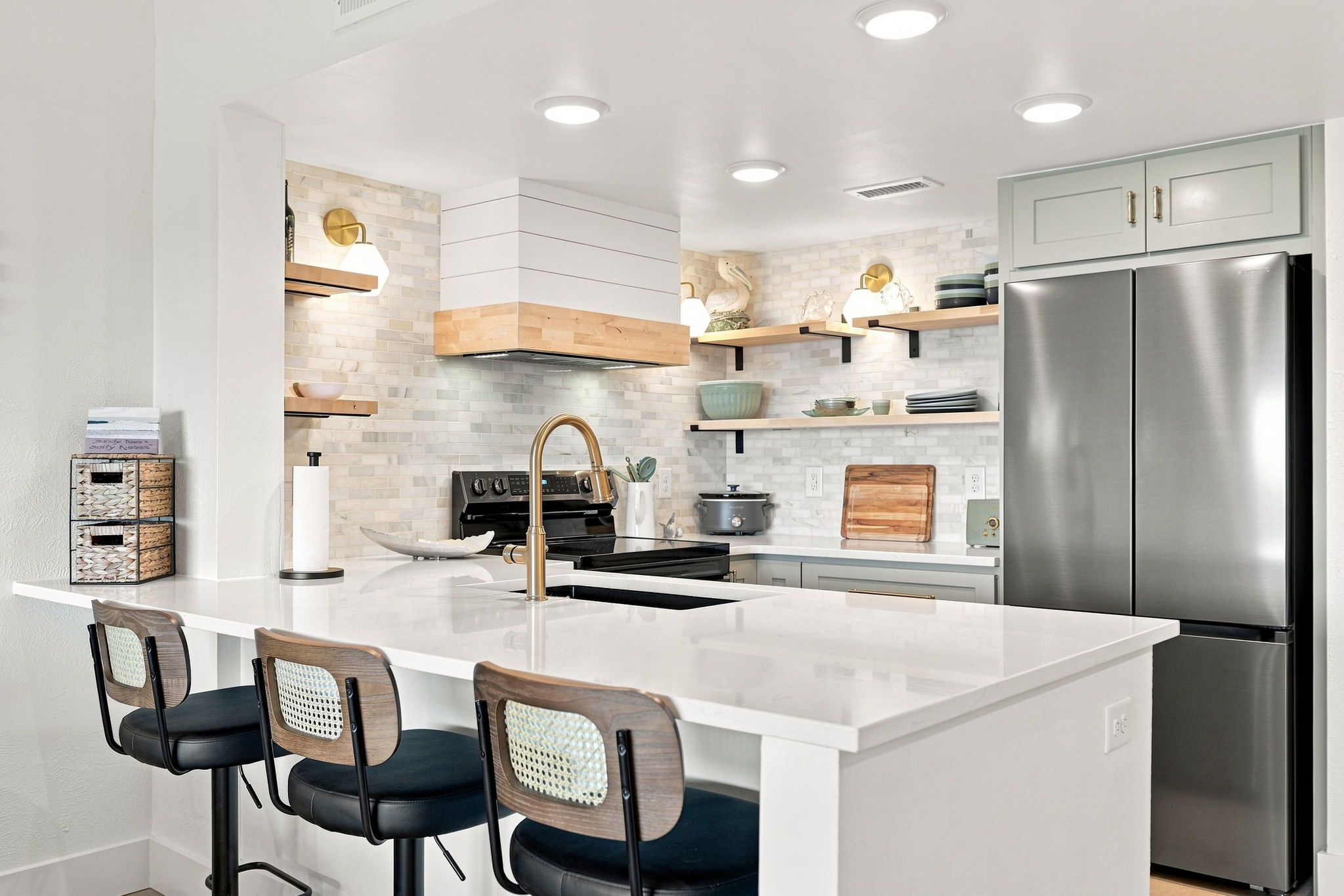 A kitchen this beautiful might make you want to cook on vacation... Clean, crisp, and completely contemporary.

