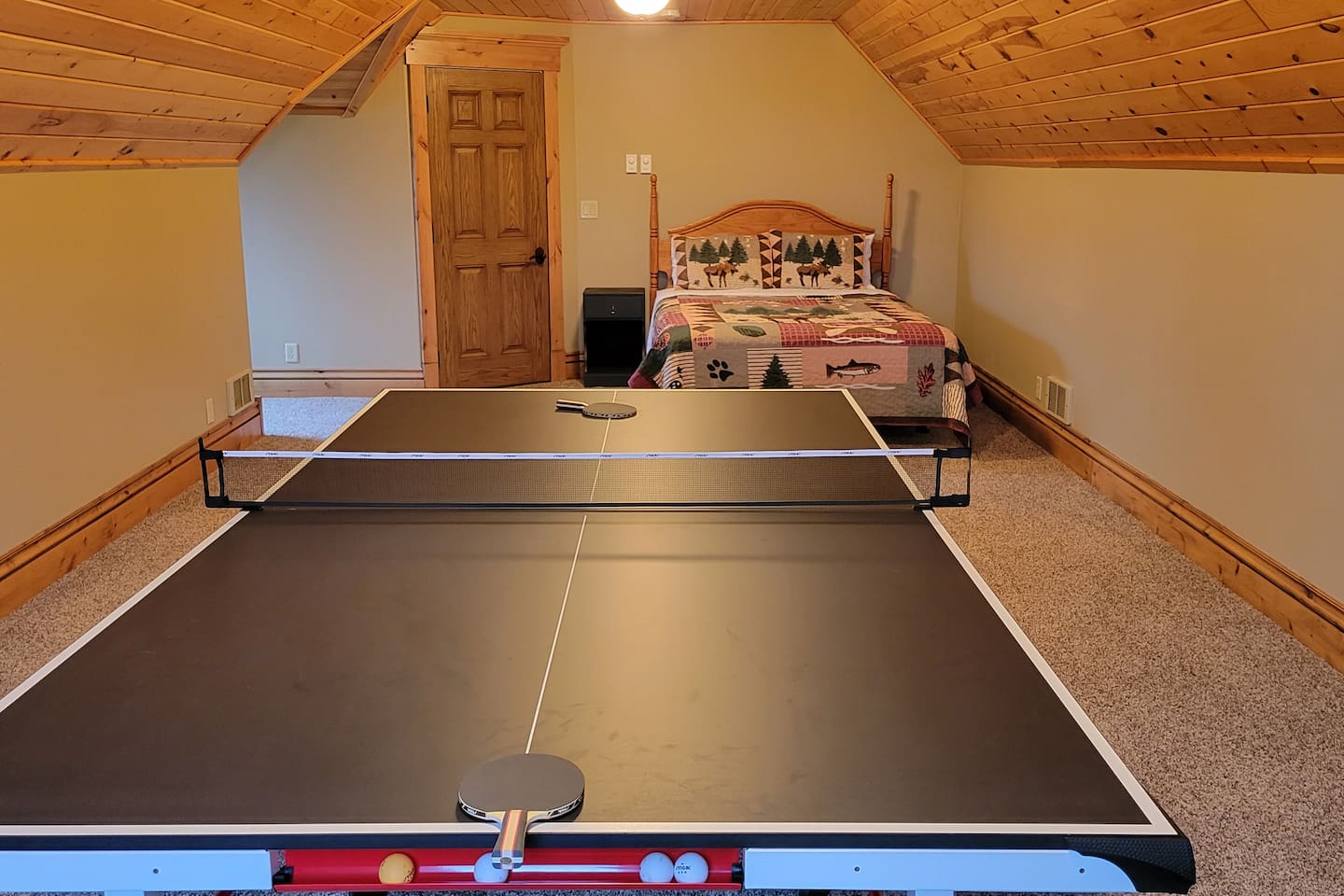 Game Room / Bonus room over garage - includes queen bed, but bathroom access is downstairs, through laundry room, and into house.