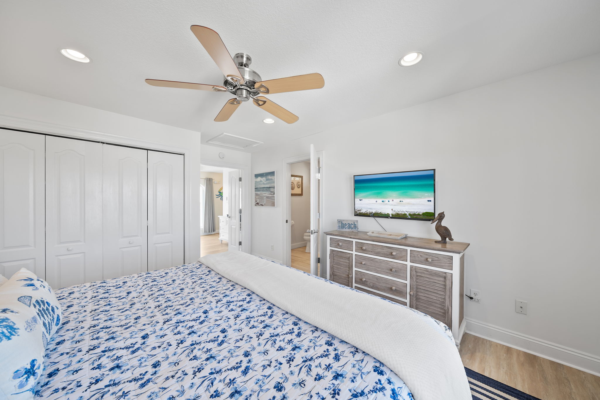 Large bedroom with a renovated master bathroom.