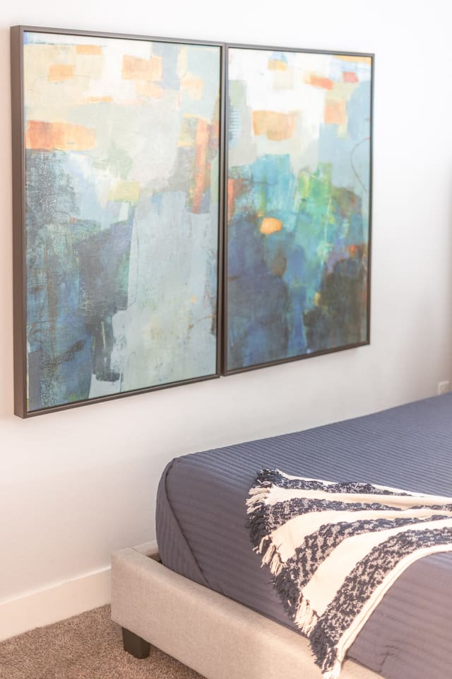 Decorative hanging frames, adding a personal and artistic touch to the room's decor.