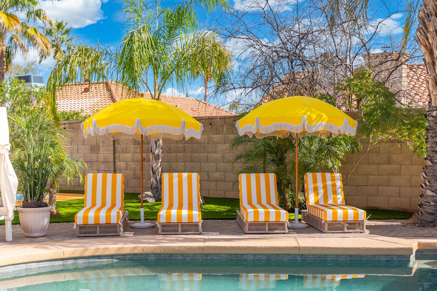 Enjoy the heat without getting sunburnt on these comfy loungers under umbrellas.