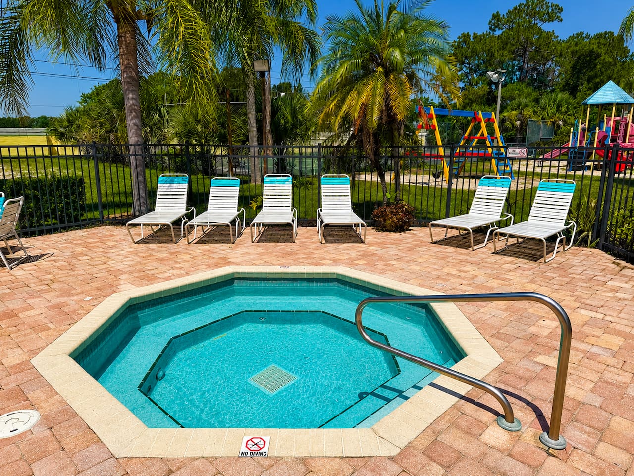 Relax in the community hot tub while children enjoy the nearby playground.