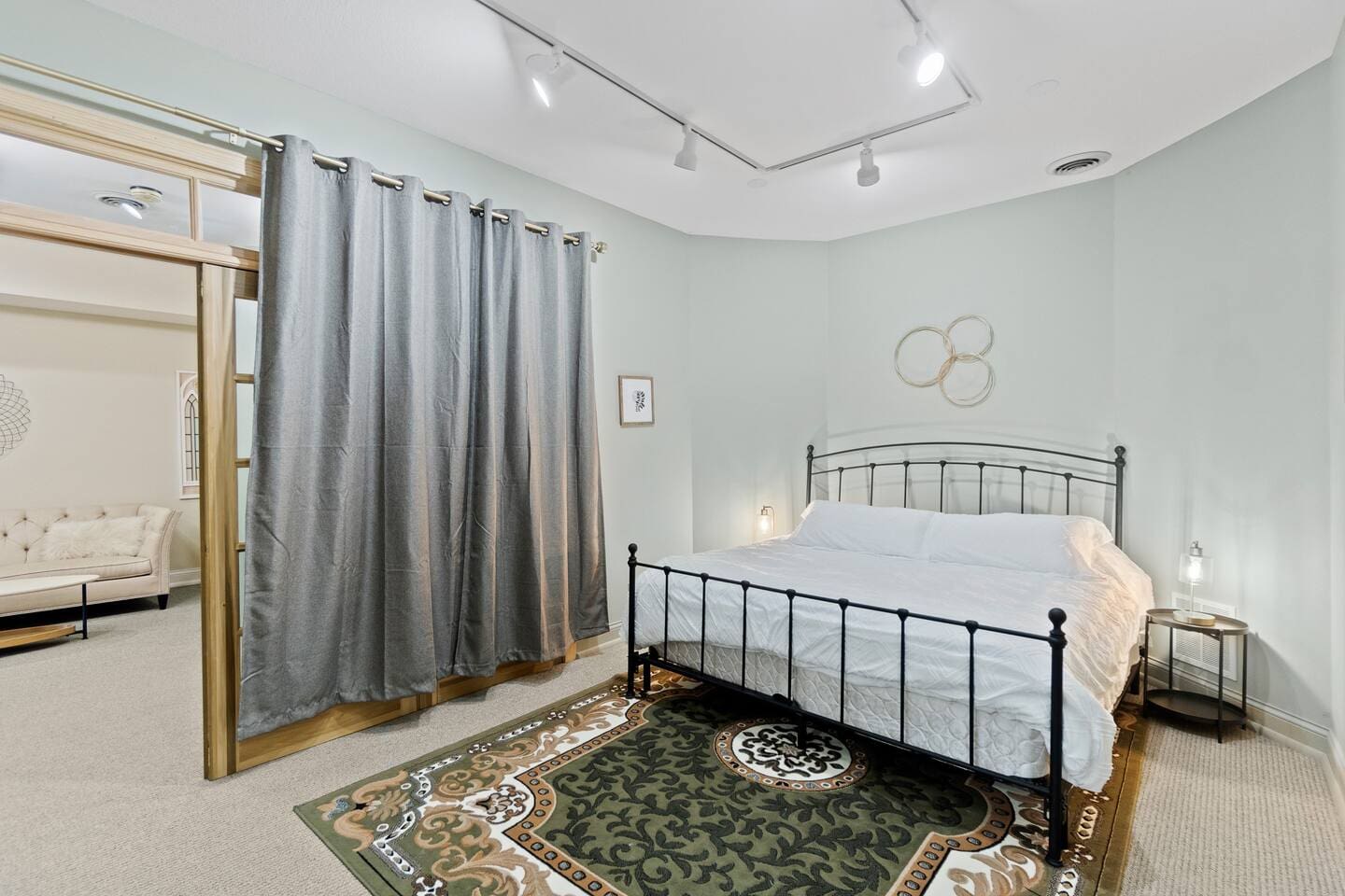 Elegant king-sized bed with a stylish bed frame, offering both comfort and a touch of luxury for a restful night's sleep.