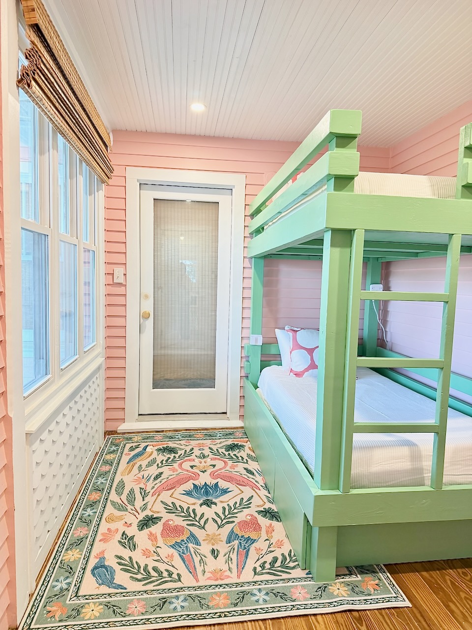 Bright coastal bunk room with built-in twin bunks—perfect for kids or extra guests.