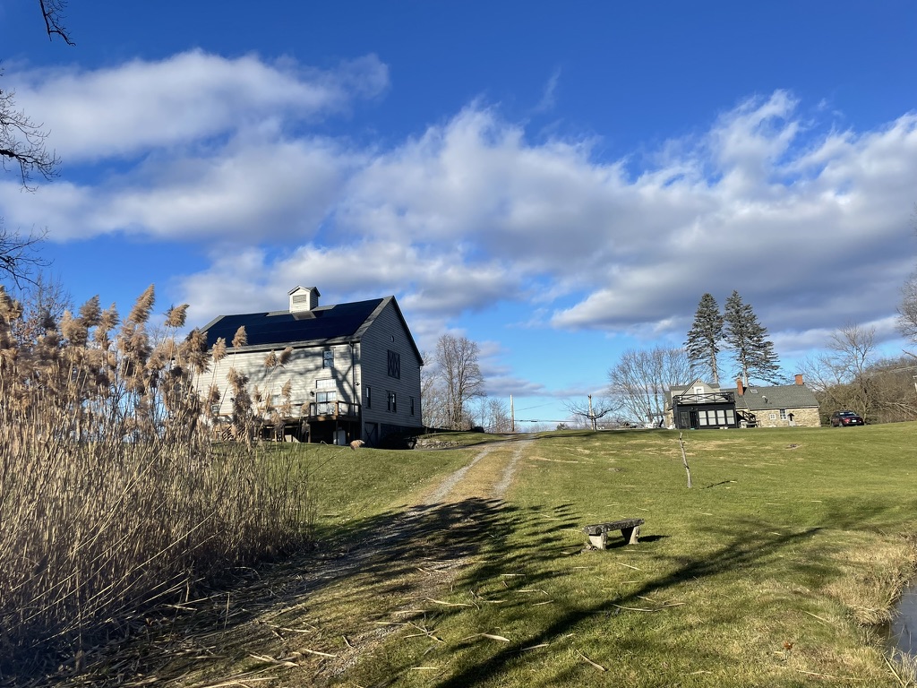 House and barn are separated by a private gravel road
